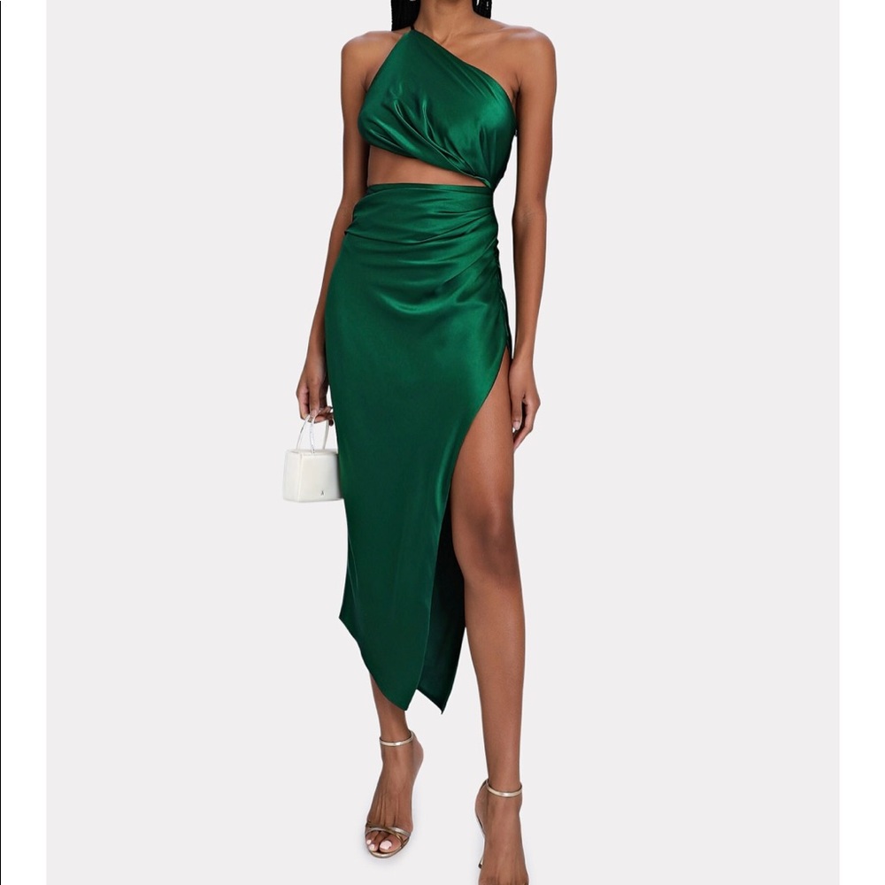 One shoulder cut out dress in xs.  Stunning brand new, never worn in green.